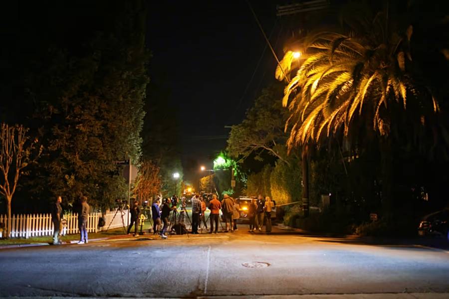 News media gather near Rob Reiner’s residence Sunday, Dec. 14, 2025, in the Brentwood section of Los Angeles.