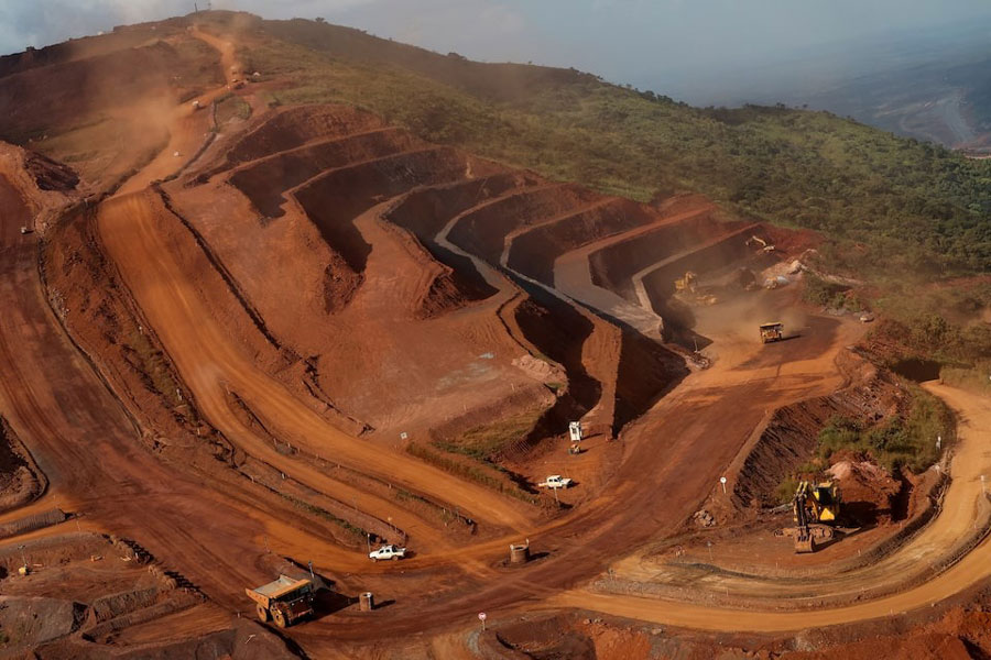 Mining vehicles operate at the blocks three and four of the Simandou mine, one of the largest high-grade iron ore deposits, run by Rio Tinto and partners' joint venture, SimFer, in the Nzerekore Region, Guinea November 4, 2025.