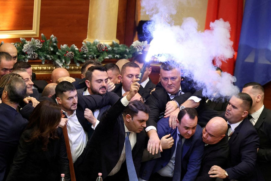 Members of parliament from the Democratic Party, Albania's biggest opposition party, protest against the government inside the parliament in Tirana, Albania, December 18, 2025.