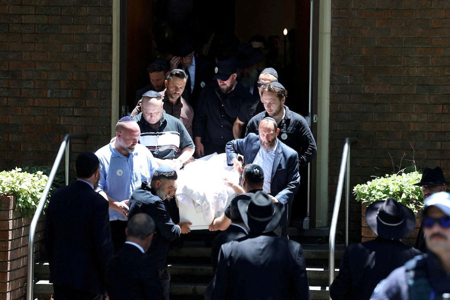 Mourners carry the casket of 10-year-old Matilda the youngest victim of a mass shooting at Australia's Bondi Beach targeting an event for the Jewish festival of Hanukkah on Sunday, at Chevra Kadisha Memorial Hall, in Sydney, Australia, December 18, 2025.