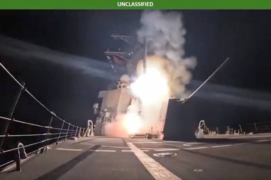 A missile is launched from a military vessel at an unidentified location, in this screen grab obtained from a handout video released by the Department of War on December 25, 2025.