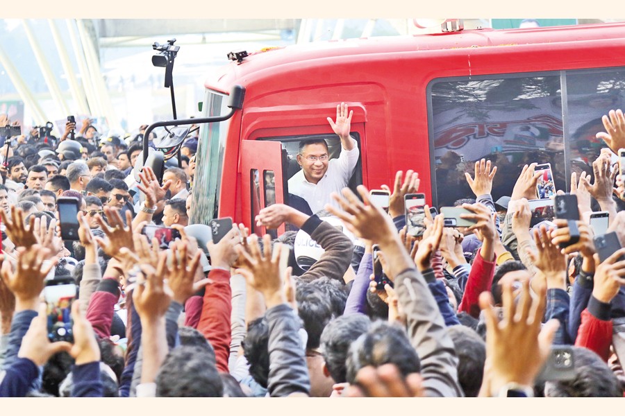 BNP acting chairman Tarique Rahman waves at cheering crowds from a bus on his way to the grave of his father and party founder Shaheed President Ziaur Rahman at Zia Udyan in the capital’s Sher-e-Bangla Nagar area on Friday — FE photo