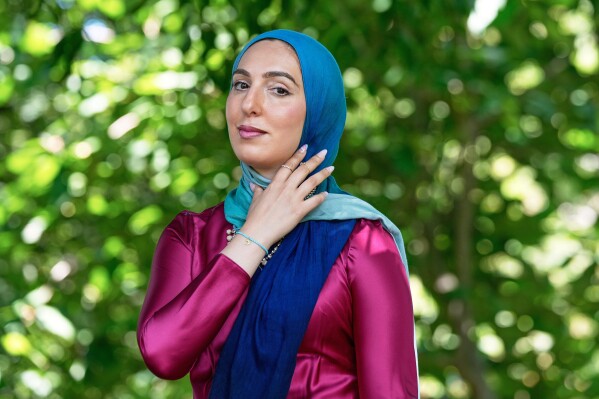 FILE - Yasmin Elhady, a matchmaker featured on the series, "Muslim Matchmaker," on Hulu, poses in Falls Church, Va, on Aug. 12, 2025. (AP Photo/Mariam Zuhaib, File)