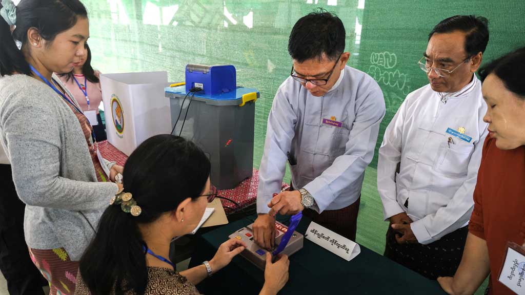 Election Commission officials prepare at a polling station inside a school ahead of a general election, in Thingangyun Township, Yangon, Myanmar, Dec 27, 2025. REUTERS