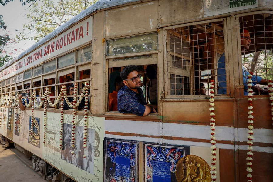 Passengers sit inside a decorated tram during the 152nd anniversary celebrations of trams in Kolkata, India, February 24, 2025.