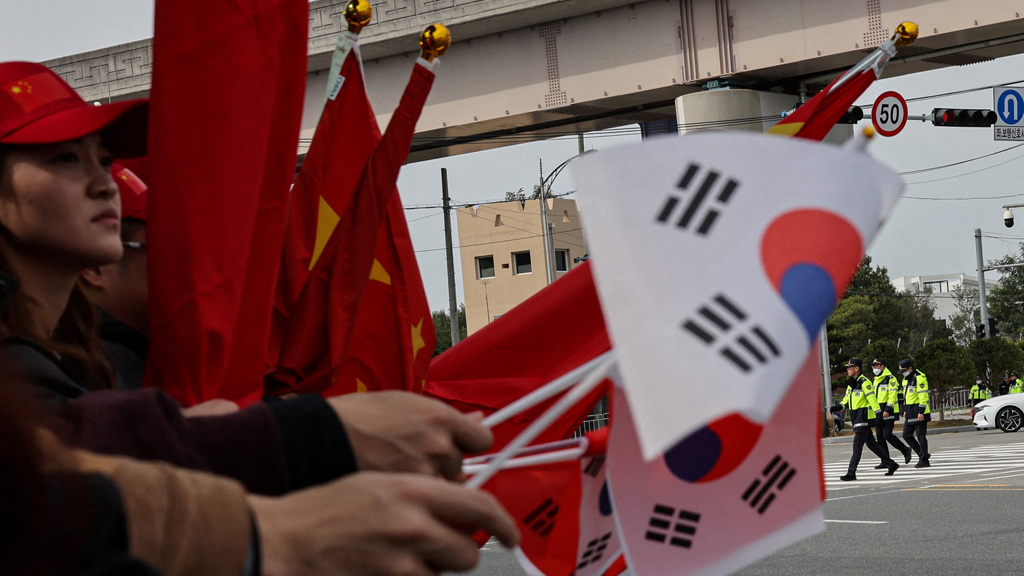 Representational photo: Pro-China supporters hold China and South Korea flags near Gimhae International Airport on the day of a bilateral meeting between US President Donald Trump and Chinese President Xi Jinping on trade tensions and bilateral relations, on the sidelines of the Asia-Pacific Economic Cooperation (APEC) Summit, in Busan, S Korea, Oct 30, 2025. REUTERS