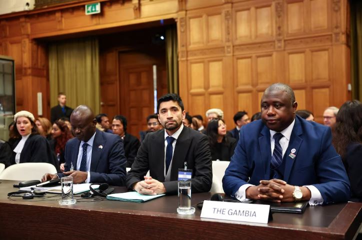 Gambia's Justice Minister and Attorney General Dawda Jallow sits next to attorney Arsalan Suleman, as the International Court of Justice (ICJ) starts two weeks of hearings in a landmark case brought by Gambia, which accuses Myanmar of committing genocide against the Rohingya, a minority Muslim group, in The Hague, Netherlands, January 12, 2026. REUTERS/Piroschka van de Wouw
