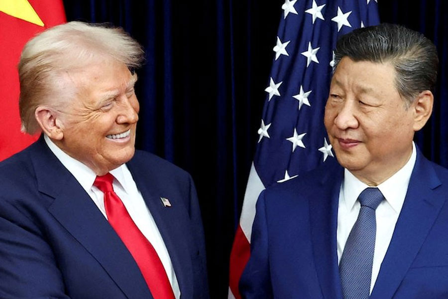 US President Donald Trump and Chinese President Xi Jinping react as they hold a bilateral meeting at Gimhae International Airport, on the sidelines of the Asia-Pacific Economic Cooperation (APEC) summit, in Busan, South Korea, October 30, 2025.