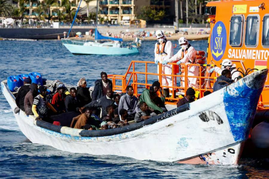 A Spanish Coast Guard vessel tows a fibreglass boat with migrants onboard to the port of Arguineguin, on the island of Gran Canaria, Spain, March 5, 2025.