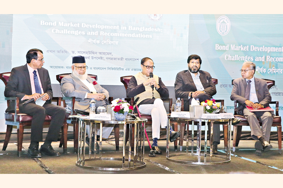 Bangladesh Bank Governor Ahsan H Mansur speaks at a seminar on ‘Bond Market Development in Bangladesh: Challenges and Recommendations’ held at a city hotel on Monday. President of International Chamber of Commerce Bangladesh (ICCB), Mahbubur Rahman, also spoke at the event, among others . — FE Photo