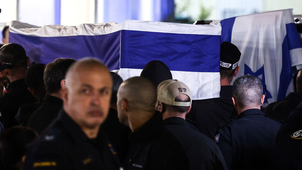 Police gather around the coffin of Israeli police officer, and the last hostage Ran Gvili who was kidnapped in the October 7, 2023, Hamas attack and was found and identified in the Gaza Strip, according to the statement by the Israeli military, at the Institute of Forensic Medicine in Tel Aviv, Israel, Jan 26, 2026. REUTERS
