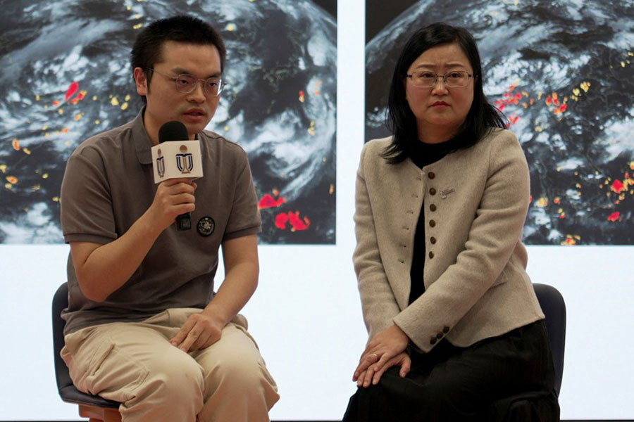 Researchers Su Hui and Dai Kuai from Hong Kong University of Science and Technology (HKUST) attend a press conference about an artificial intelligence (AI) weather‑forecasting system, in Hong Kong, China Jan 28, 2026.