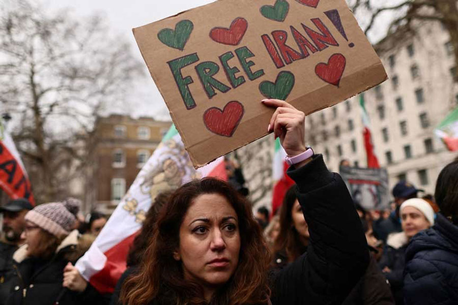A woman holds a placard on Whitehall during a demonstration in support of the nationwide protests in Iran, in London, Britain, Jan 25, 2026.