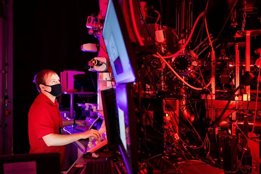Researcher Ryan Schoell of the US government's Sandia National Laboratories in New Mexico uses a specialized transmission electron microscope technique developed by scientists Khalid Hattar, Dan Bufford and Chris Barr to study fatigue cracks at the nanoscale, Nov 16, 2022.