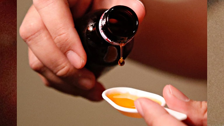 A cough medication is poured in this picture illustration taken Oct 19, 2022.