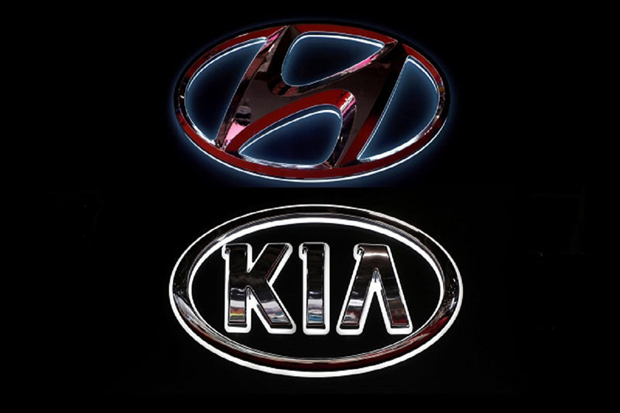 The logos of Hyundai Motor and Kia are seen in this undated combination photo