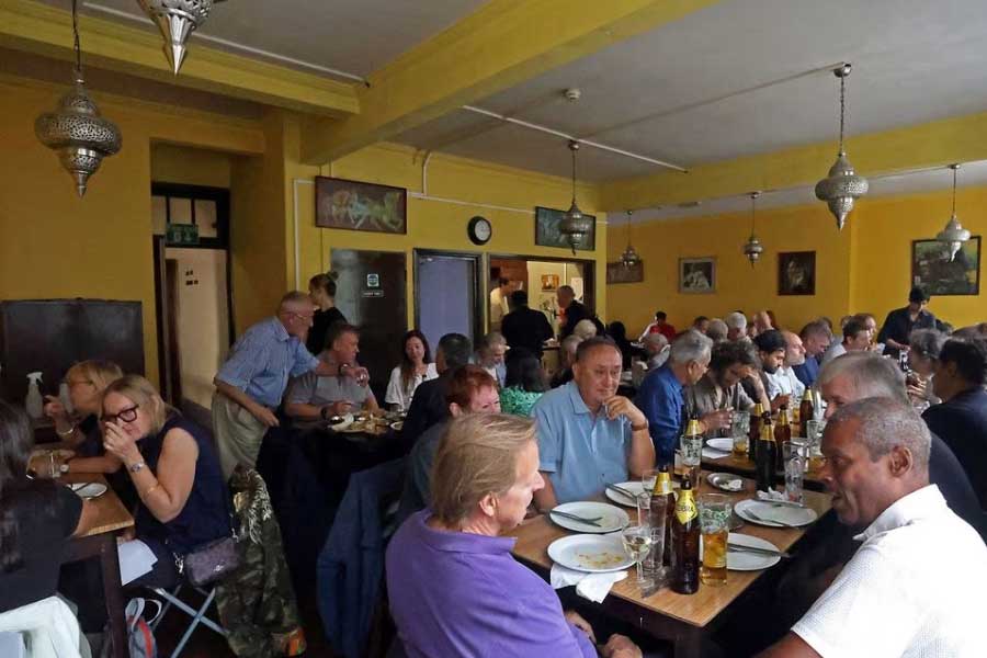 Customers eating lunch in the restaurant of the India Club in London on Wednesday –Reuters photo