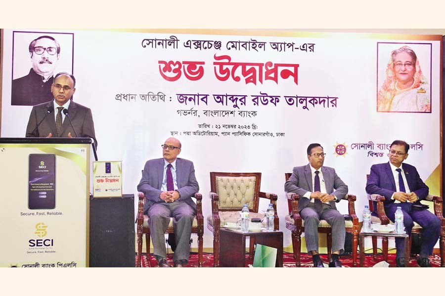 Bangladesh Bank Governor Abdur Rouf Talukder speaks at the launching ceremony of 'Sonali Exchange Mobile App' at a city hotel on Tuesday. Sitting from left are Dr Md Khairuzzaman Mozumder, Secretary of the Finance Division under the Ministry of Finance; Sheikh Mohammad Salim Ullah, Secretary of the Financial Institutions Division; and Md Afzal Karim, CEO and Managing Director of Sonali Bank.