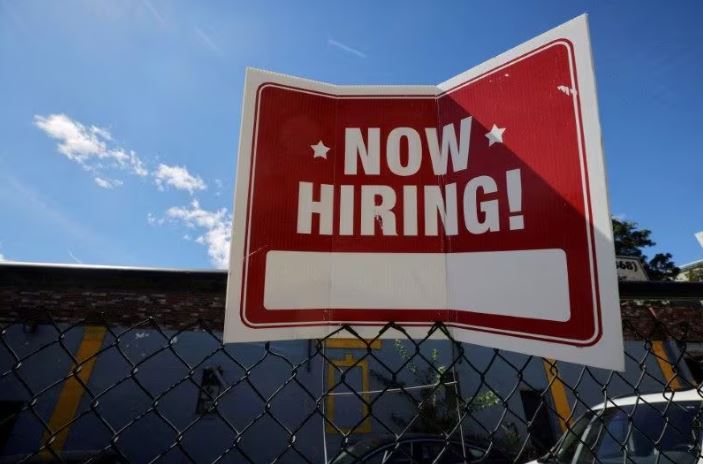 A "now hiring" sign is displayed outside Taylor Party and Equipment Rentals in Somerville, Massachusetts, U.S., September 1, 2022. REUTERS/Brian Snyder/File Photo