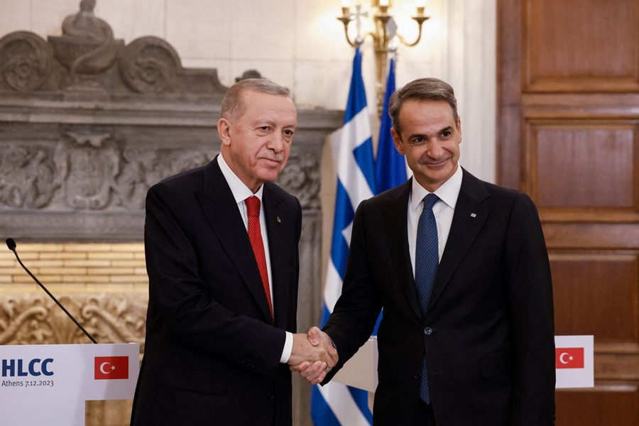 Greek Prime Minister Kyriakos Mitsotakis shakes hands with Turkish President Tayyip Erdogan during a press conference at the Maximos Mansion in Athens, Greece, December 7, 2023.