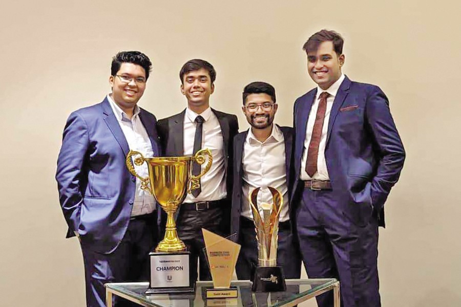 Team Khichuri from IBA, Dhaka University posing with some of the trophies they won -- from left Mohtasim Bin Habib, Turjoy Chakraborty, Mashrif Hasan Adib, and Abir Ershad