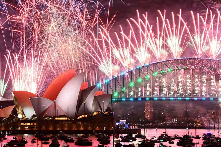 Fireworks are seen over the Sydney Opera House and Harbour Bridge during New Year’s Eve celebrations in Sydney, Australia January 1, 2024. AAP Image/Dan Himbrechts via REUTERS
