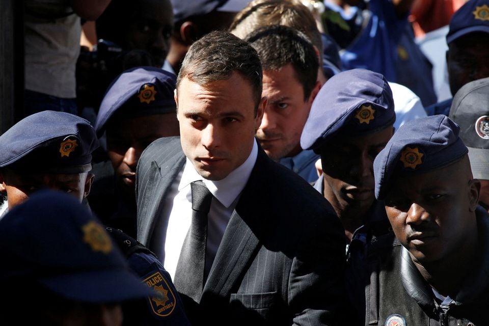 South African Olympic and Paralympic sprinter Oscar Pistorius arrives at the North Gauteng High Court in Pretoria on October 21, 2014 — Reuters/Files