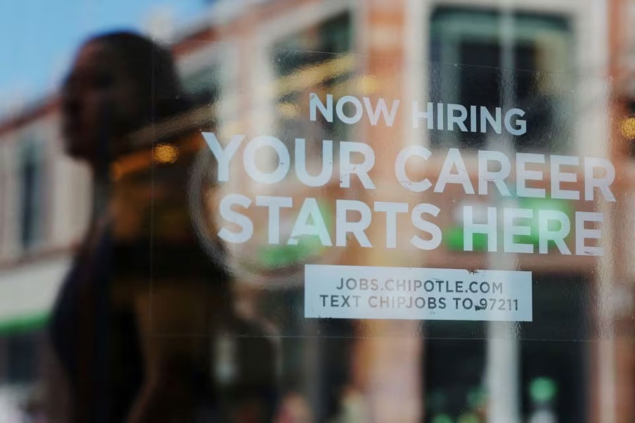 A Chipotle restaurant advertises it is hiring in Cambridge, Massachusetts, US, August 28, 2023. REUTERS/Brian Snyder/File Photo Acquire Licensing Rights