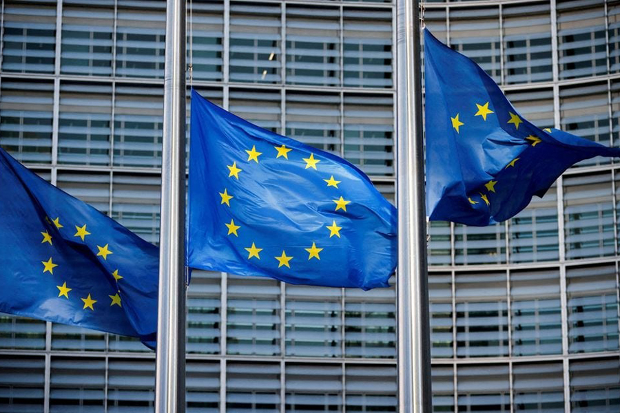 European Union flags fly outside the European Commission headquarters in Brussels, Belgium, March 1, 2023.