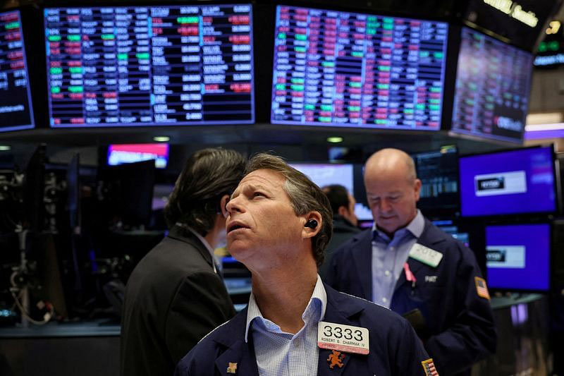 Traders work on the floor at the New York Stock Exchange (NYSE) in New York City, US, January 9, 2024.