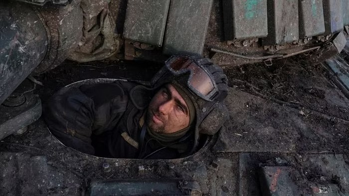 A Ukrainian serviceman looks on from a tank near the frontline town of Bakhmut, amid Russia's attack on Ukraine, in Donetsk region, Ukraine Mar 7, 2023.