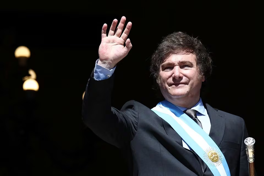 Argentina's President Javier Milei waves to supporters from the Casa Rosada balcony, after his swearing-in ceremony, in Buenos Aires, Argentina December 10, 2023—REUTERS