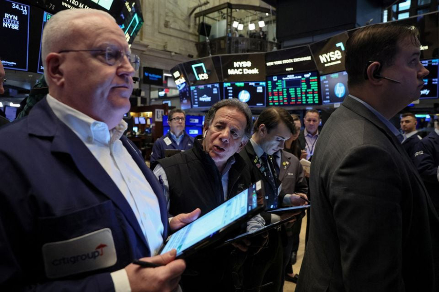 Traders work on the floor at the New York Stock Exchange (NYSE) in New York City, US, February 29, 2024.