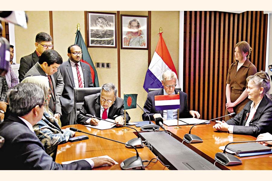 Bangladesh Finance Minister Abul Hasan Mahmud Ali and Netherlands' Minister for Tax Affairs and the Tax Administration M.L.A. van Rij signing an agreement to avoid double taxation and prevent revenue evasion on behalf of their respective nations at the Ministry of Finance in city on Tuesday