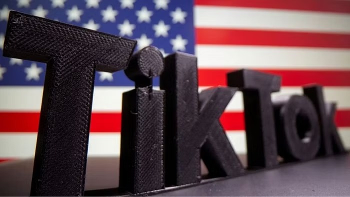 A 3D-printed Tik Tok logo is seen in front of US flag in this illustration taken Oct 6, 2020.