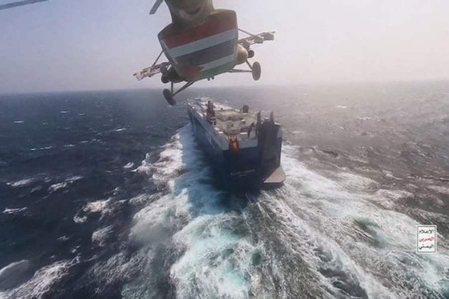 Houthi military helicopter flies over the Galaxy Leader cargo ship in the Red Sea in this photo released November 20, 2023 — Houthi Military Media/Handout via REUTERS/File photo used only for representation