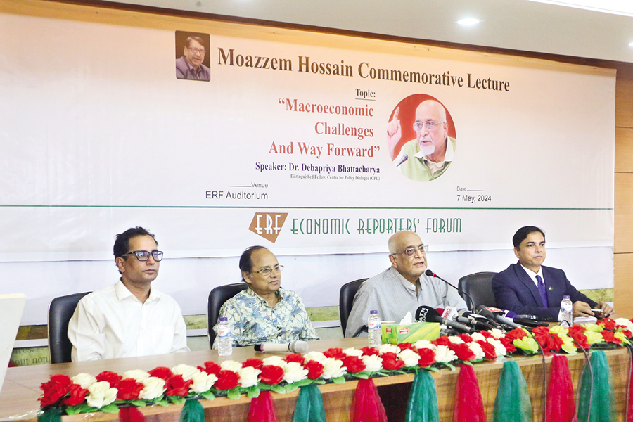 Distinguished Fellow at the Center for Policy Dialogue Dr Debapriya Bhattachariya (Second from right) speaking at the Moazzem Hossain Commemorative Lecture on 'Macroeconomic Challenges and Way Forward' organised by the Economic Reporters Forum at its office in the city on Tuesday. On his right is Editor of The Financial Express Shamsul Huq Zahid — FE photo