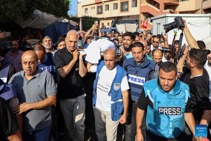 Palestinian journalists attend a funeral of Palestine TV correspondent Muhammad Abu Hatab, who was killed in his home by an Israeli raid, in the southern Gaza Strip city of Khan Younis, on November 3, 2023