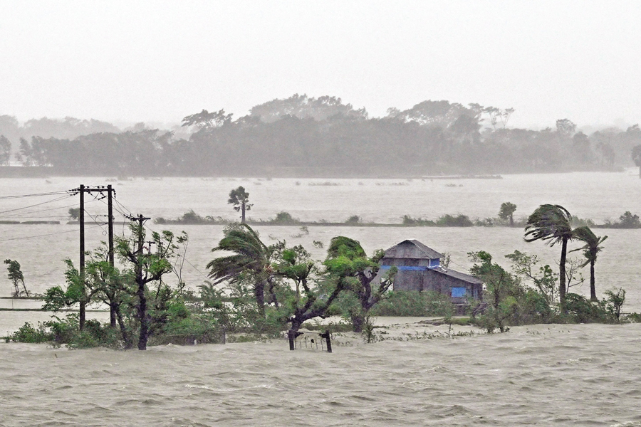 Marooned houses are seen during heavy rainfall in Patuakhali on Monday following the landfall of Cyclone Remal in Bangladesh. — AFP