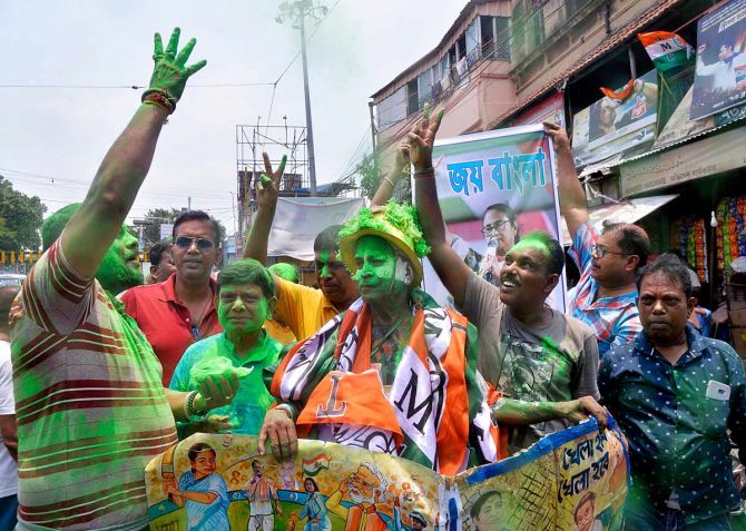 TMC workers celebrate as the trends show the party races ahead in West Bengal - ANI Photo