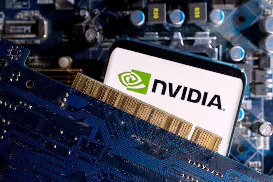 A smartphone with a displayed NVIDIA logo is placed on a computer motherboard in this illustration taken March 6, 2023.