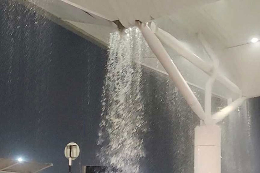 Water seeps through the roof amid heavy rain at Terminal 1 of the Indira Gandhi International Airport, New Delhi, India June 28, 2024 in this screen grab obtained from a social media video.