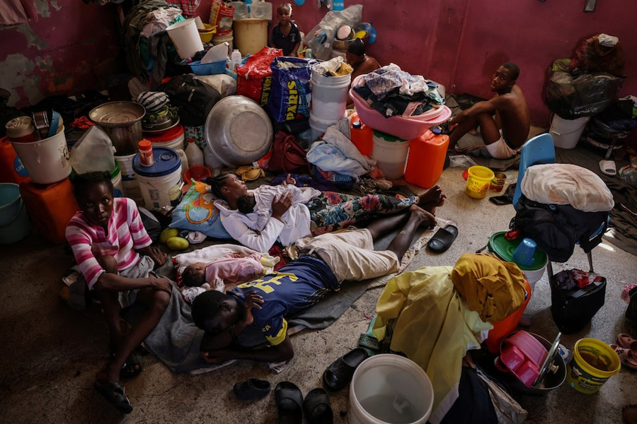 People displaced by gang war violence live inside a classroom at Darius Denis school, which transformed into a shelter where people live in poor conditions, in Port-au-Prince, Haiti May 5, 2024. Nearly half of the country’s population is struggling to feed themselves due to the conflict, unable to work, the families depend on food rations and hygiene kits brought in by non-governmental organizations. “We can’t do anything - there’s no money, no trade,” said Mirriam Auge, 45, a mother who was forced out of her home three months ago. “We lost everything in our homes, I cried while everyone was sleeping.”