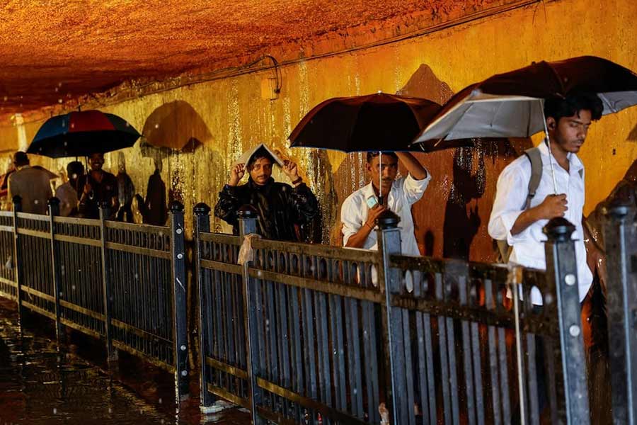 People walking in a waterlogged subway after heavy rains in Mumbai in India on Monday –Reuters photo