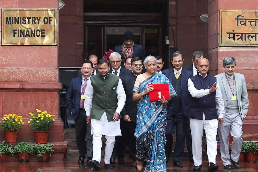 India's Finance Minister Nirmala Sitharaman holds up a folder with the Government of India's logo as she leaves her office to present the interim federal budget in the parliament, ahead of the nation's general election, in New Delhi, India, February 1, 2024.