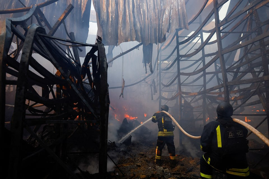 Firefighters work at the site of a household item shopping mall which was hit by a Russian air strike, amid Russia’s attack on Ukraine, in Kharkiv, Ukraine, May 25, 2024.