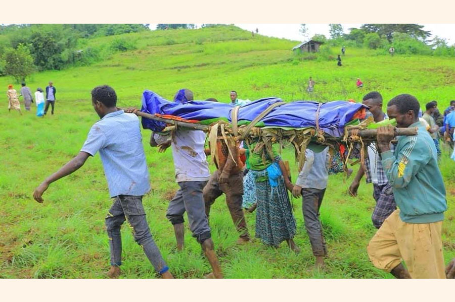 Residents carry the dead body of a victim of the landslide following heavy rains that buried people in Gofa zone, Southern Ethiopia Jul 23, 2024.