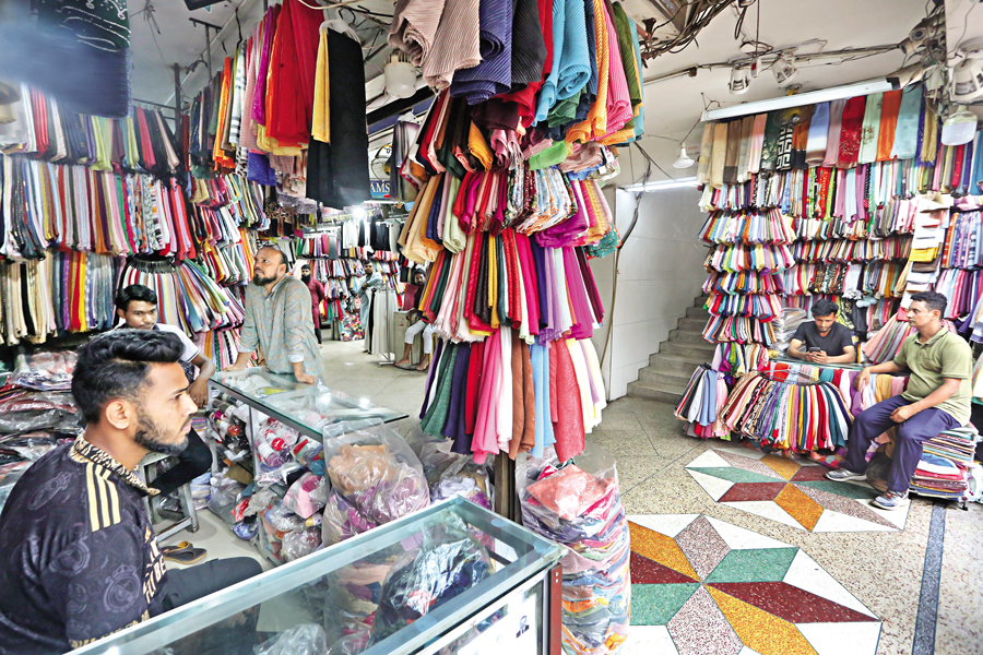 Fashion retailers at a Mirpur Road shopping mall in Dhaka sit idle on Saturday as sales plummet amid widespread protests. The area is a popular shopping destination for middle-class residents. — FE Photo