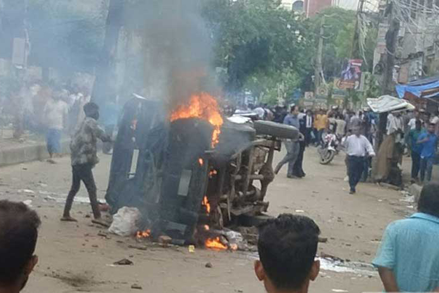 Police vehicle on fire at the capital's Johnson Road