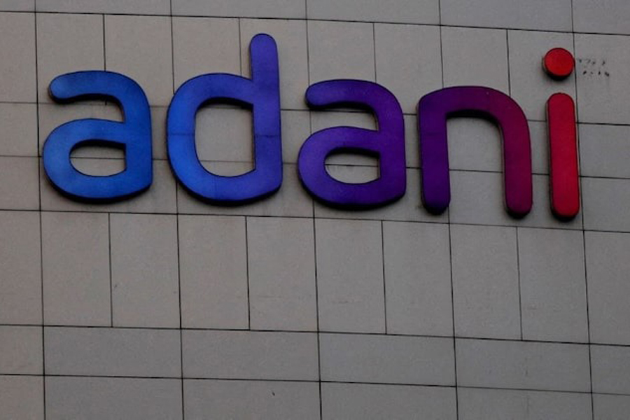 The logo of the Adani Group is seen on the facade of its Corporate House on the outskirts of Ahmedabad, India, January 27, 2023.